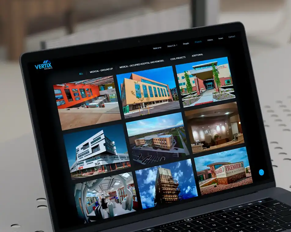 Custom portfolio gallery for Vertix Builders displaying commercial construction projects in a responsive grid layout.
