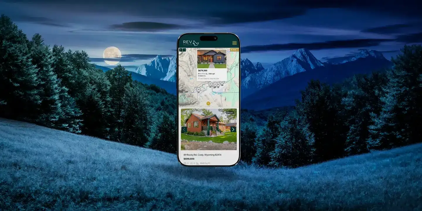 Colorado mountain town business website design on laptop with scenic mountain backdrop