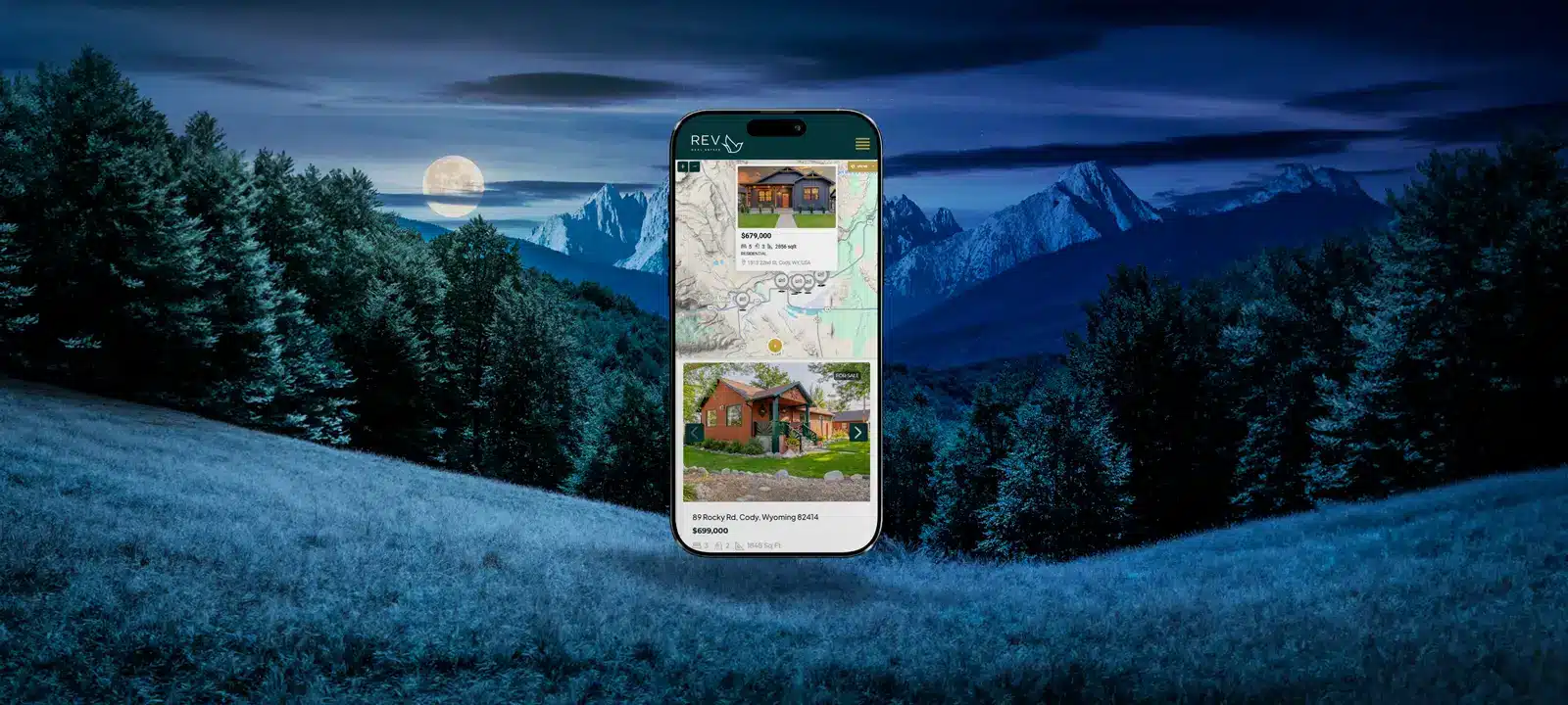 Colorado mountain town business website design on laptop with scenic mountain backdrop