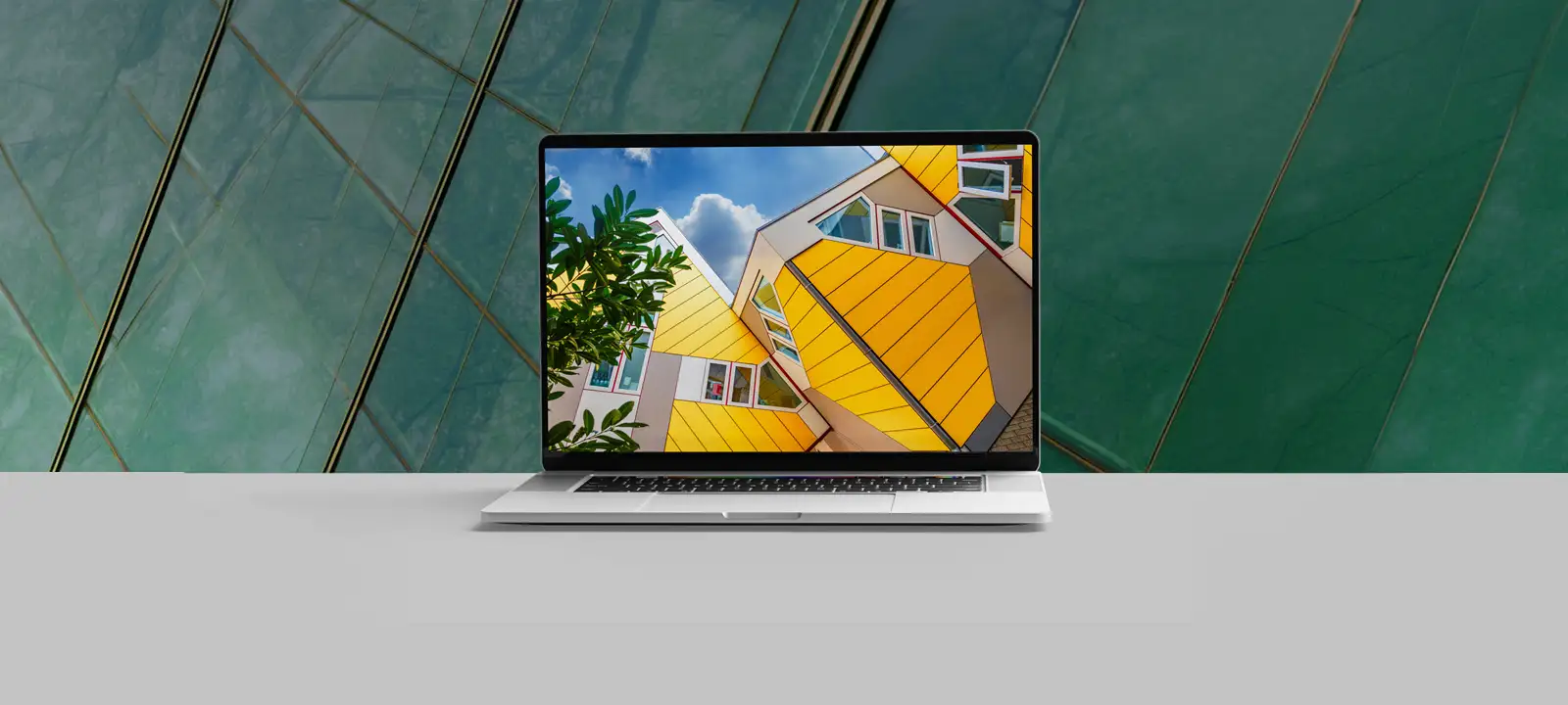 Laptop displaying a colorful architectural website design
